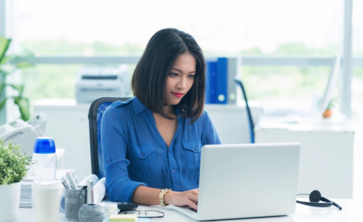 Student reviewing personal budget spreadsheet and financial documents
